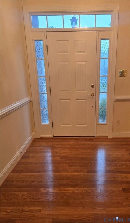 4401 Village Garden Circle, Chester, VA 23831 Entryway featuring a paneled door with side lights and transom window, new wood engineered flooring, white baseboards, and chair rail molding