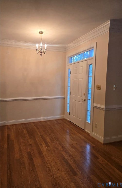 4401 Village Garden Circle, Chester, VA 23831 New Hardwood engineered flooring and crown molding in an entry area featuring a paneled door with sidelights and transom window, and a three-light chandelier