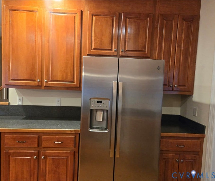 4401 Village Garden Circle, Chester, VA 23831 Stainless steel side-by-side refrigerator with an external ice and water dispenser