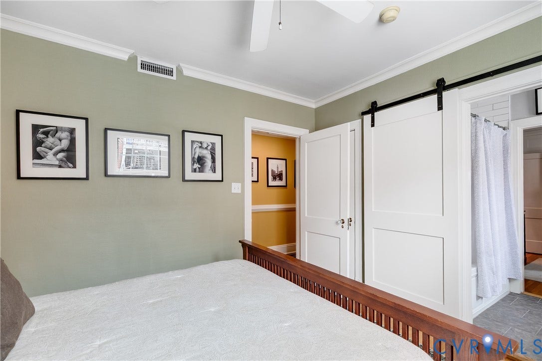 3006 Monument Avenue, #U2W, Museum District, Richmond, VA 23221 Bedroom featuring crown molding, neutral wall color, and a wood bed frame