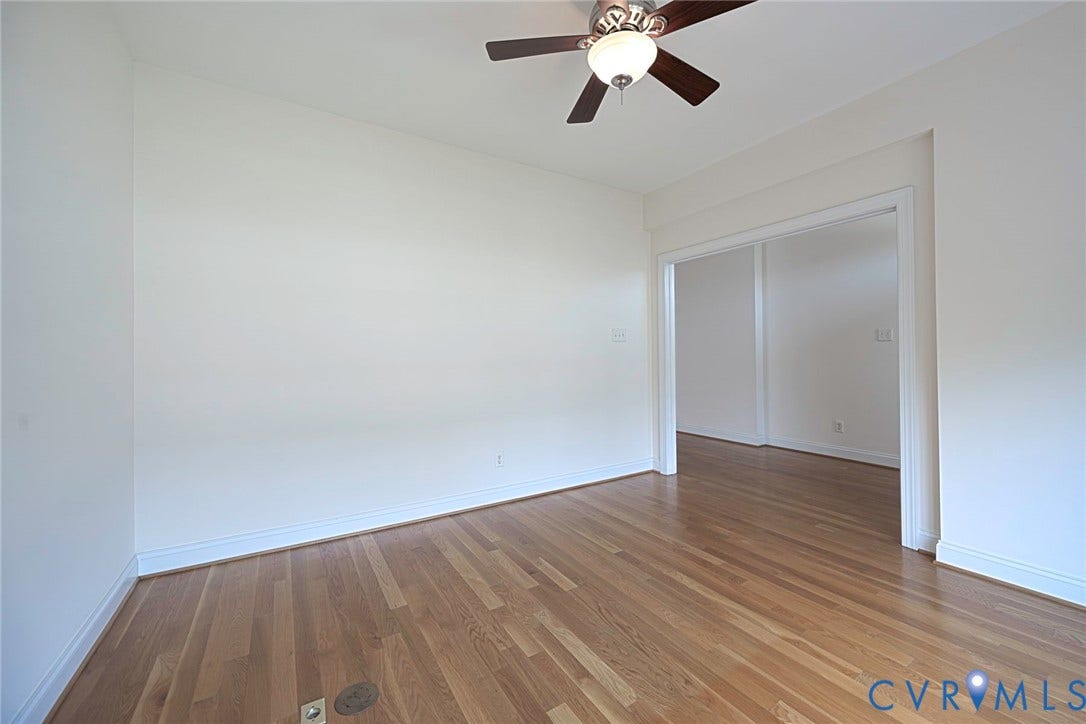 4309 Village Creek Drive, Chester, VA 23831 Room featuring wood-finish flooring, white baseboards, and a ceiling fan with integrated lighting