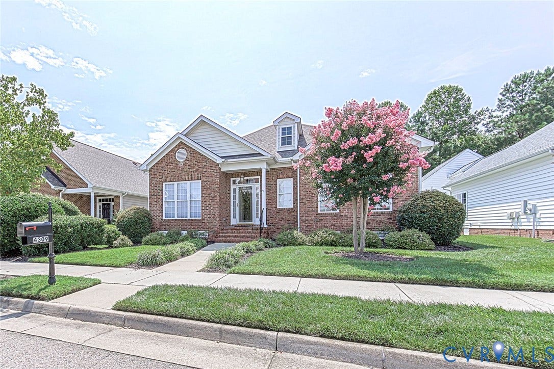 4309 Village Creek Drive, Chester, VA 23831 Brick front and brick rear exterior with white trim, a front porch, and a dormer window. Landscaping, irrigation, pruning, trash and snow removal included in HOA fee.