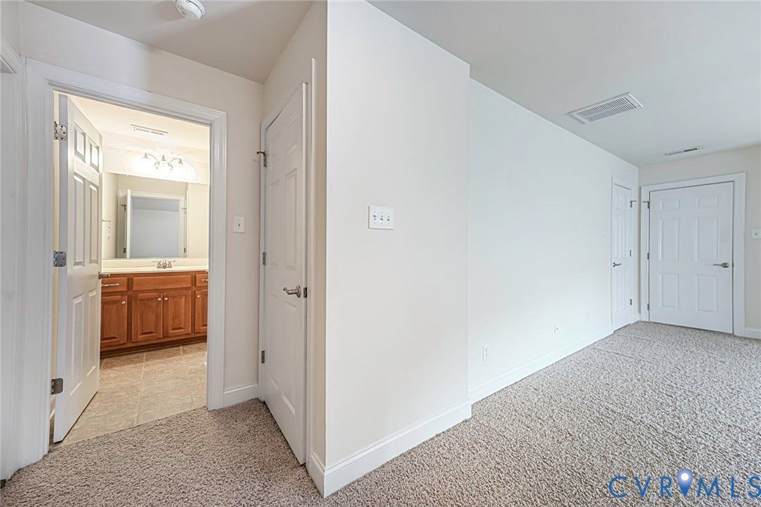 4309 Village Creek Drive, Chester, VA 23831 3rd bedroom, Carpeted room featuring a white interior door, white baseboards, and light-colored walls