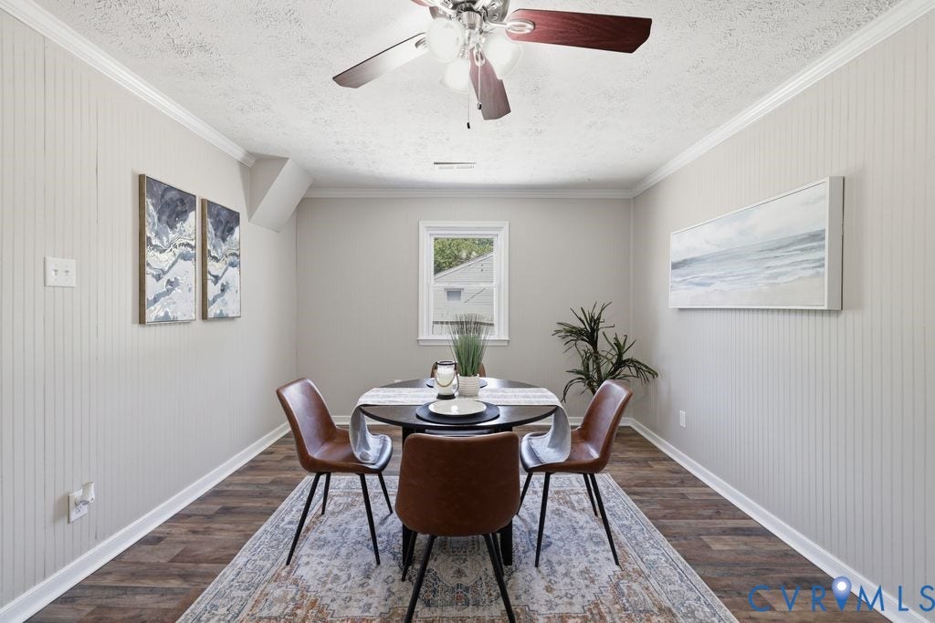 Room featuring wood-finish flooring, white beadboard paneling, and crown molding
