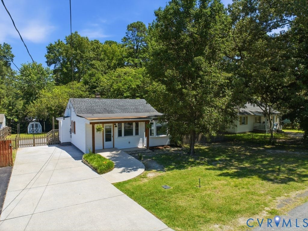 White single-story residence with a covered porch