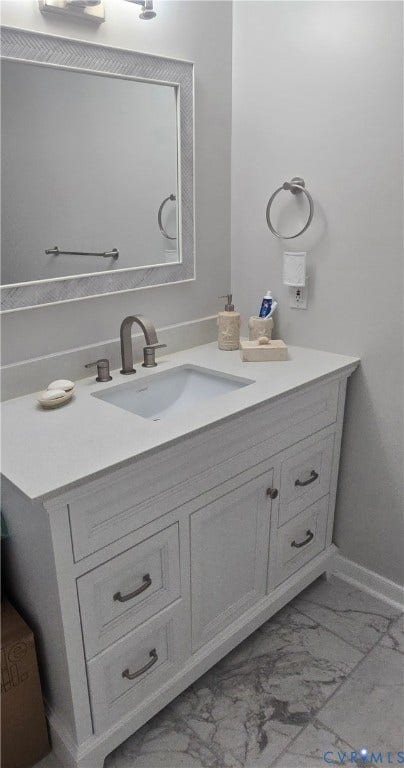 12812 Winfree Street, Chester, VA 23831 White vanity with integrated sink, stone countertop, brushed nickel faucet, and coordinating cabinet hardware