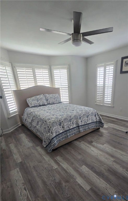 12812 Winfree Street, Chester, VA 23831 Spacious room featuring wood-finish flooring, a contemporary ceiling fan with integrated lighting, and multiple windows with plantation shutters