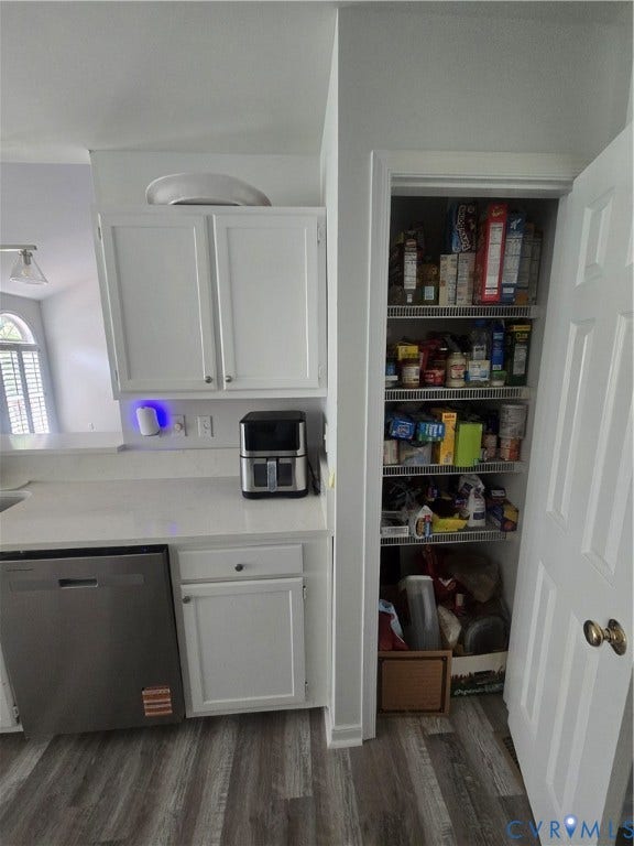 12812 Winfree Street, Chester, VA 23831 Kitchen featuring white cabinetry, light-toned countertops, a stainless steel dishwasher, and vinyl plank flooring