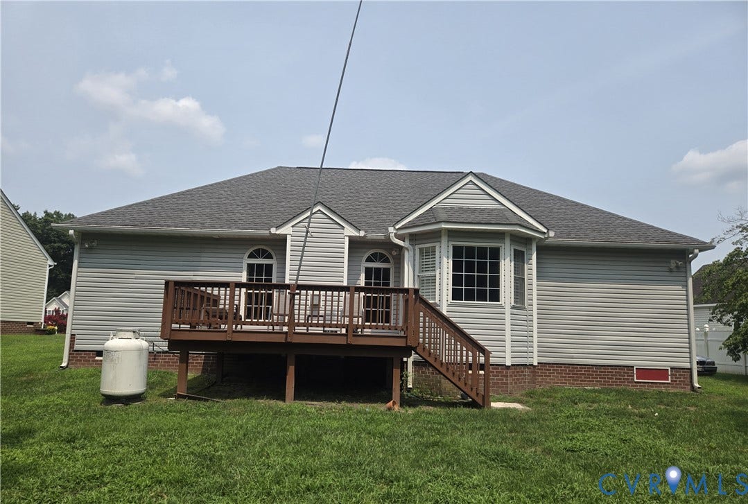 12812 Winfree Street, Chester, VA 23831 Rear exterior featuring a spacious wood-deck, bay window, and arched windows