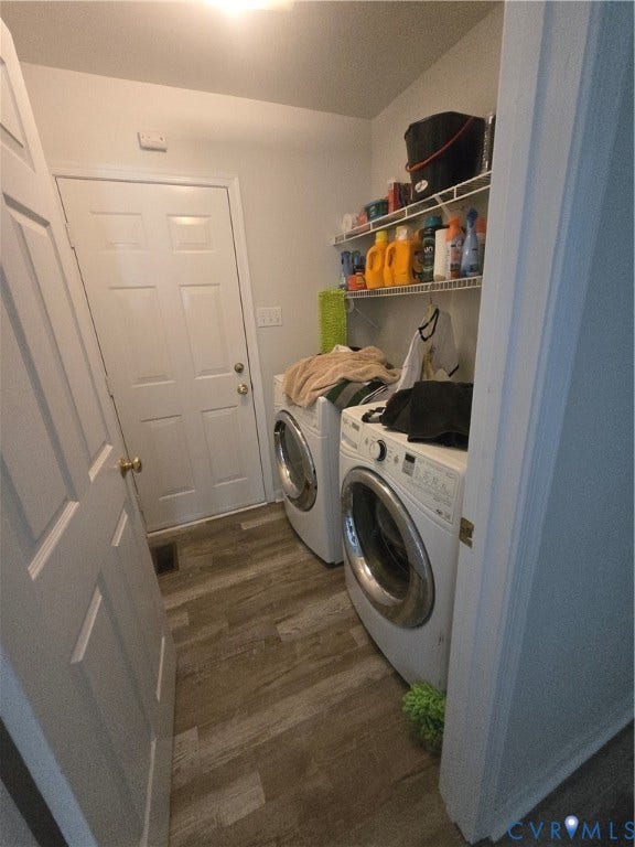 12812 Winfree Street, Chester, VA 23831 Dedicated laundry area featuring wood-finish flooring, white walls, and wire shelving for storage