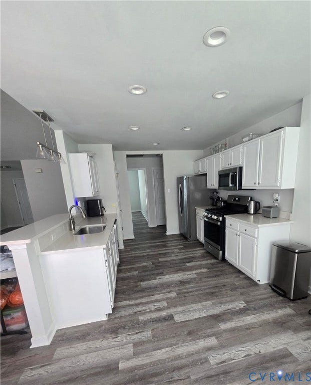 12812 Winfree Street, Chester, VA 23831 White cabinets, open to family room, vinyl plank flooring, granite counter tops, gas propane cook stove