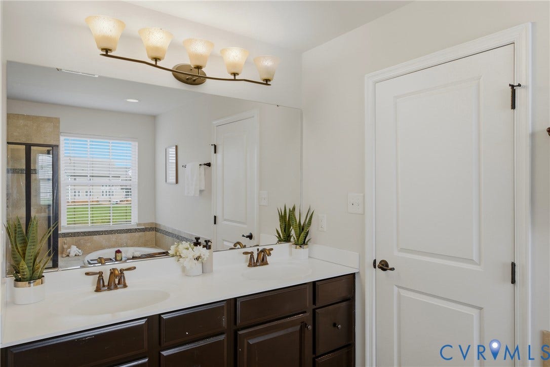 1819 White Mountain Drive, Mount Blanco On The James, Chester, VA 23836 Dual vanity with white countertop and integrated sinks
