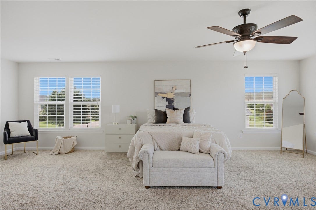 1819 White Mountain Drive, Mount Blanco On The James, Chester, VA 23836 Spacious bedroom featuring light neutral wall paint and plush carpet flooring
