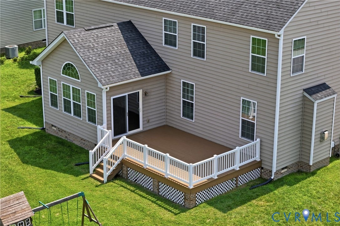 1819 White Mountain Drive, Mount Blanco On The James, Chester, VA 23836 Rear exterior featuring a sunroom, expansive deck with white railings, and siding