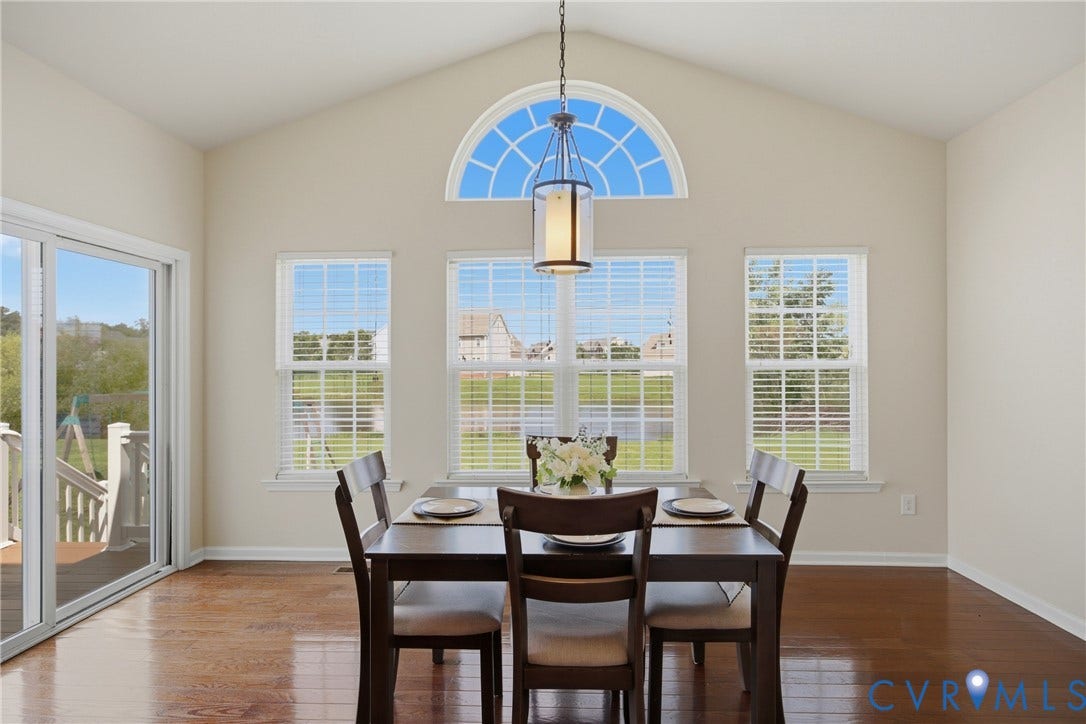 1819 White Mountain Drive, Mount Blanco On The James, Chester, VA 23836 Vaulted ceiling dining area featuring wood-finish flooring