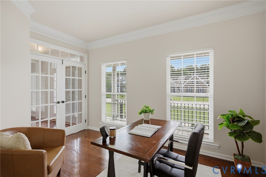 1819 White Mountain Drive, Mount Blanco On The James, Chester, VA 23836 Room featuring double French doors with transom windows, two large windows with blinds, crown molding, and wood-finish flooring