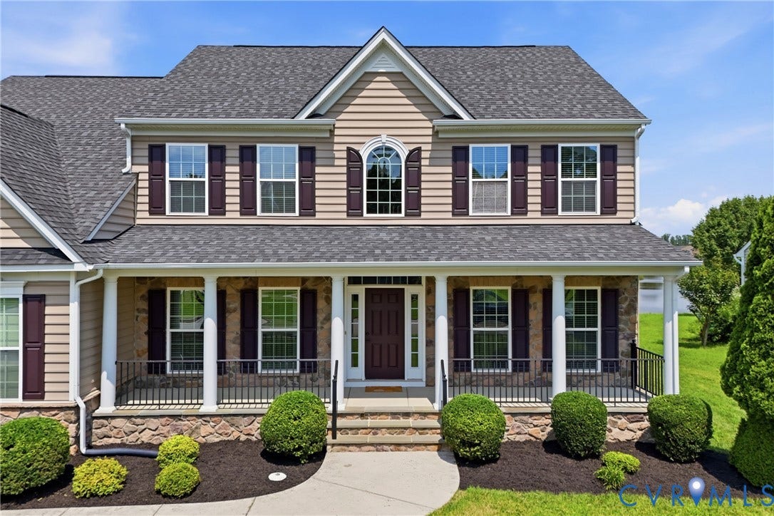 1819 White Mountain Drive, Mount Blanco On The James, Chester, VA 23836 Traditional two-story residence featuring light tan siding and a stone facade