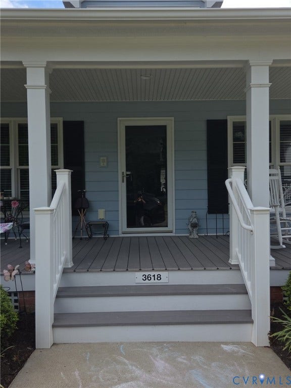 3618 Carter Trent Lane, Powhatan, VA 23139 Covered porch featuring light blue siding, black shutters, and white trim
