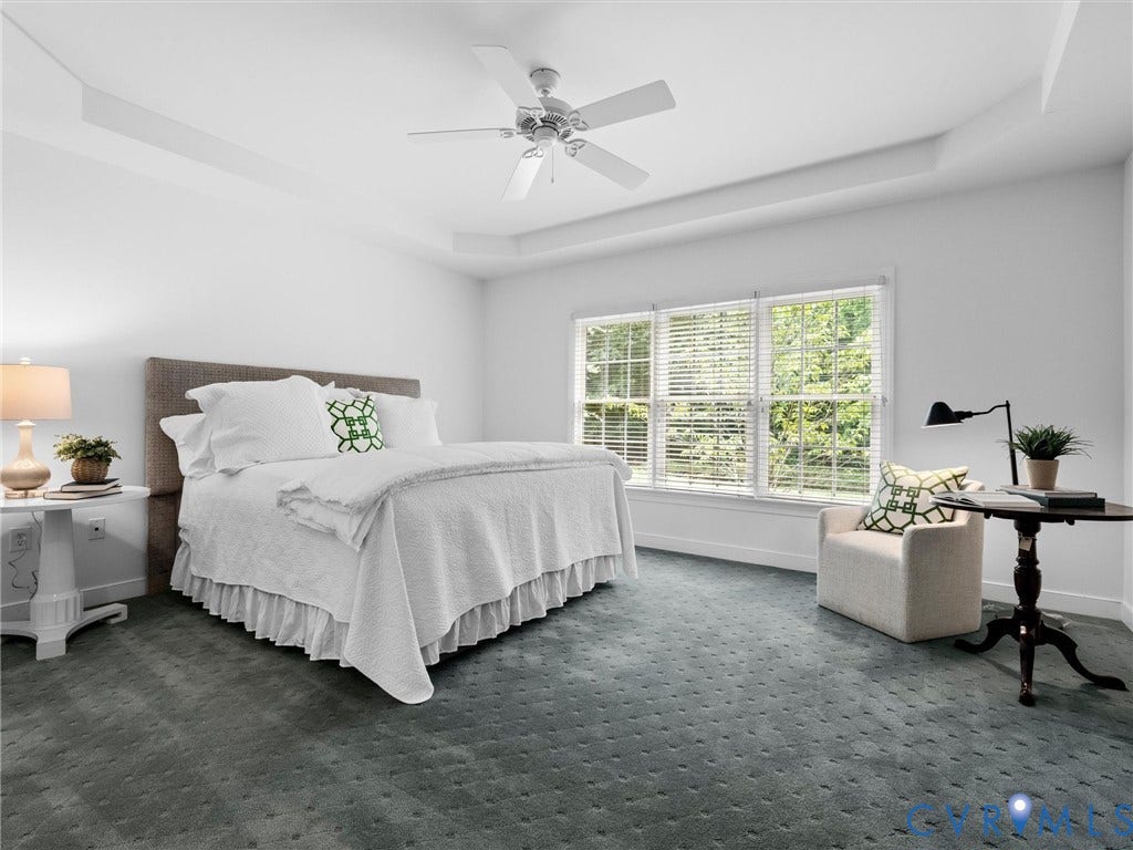 2214 Founders View Lane, Fb Golf Villas, Powhatan, VA 23113 Spacious bedroom featuring a tray ceiling, ceiling fan, and large windows with blinds