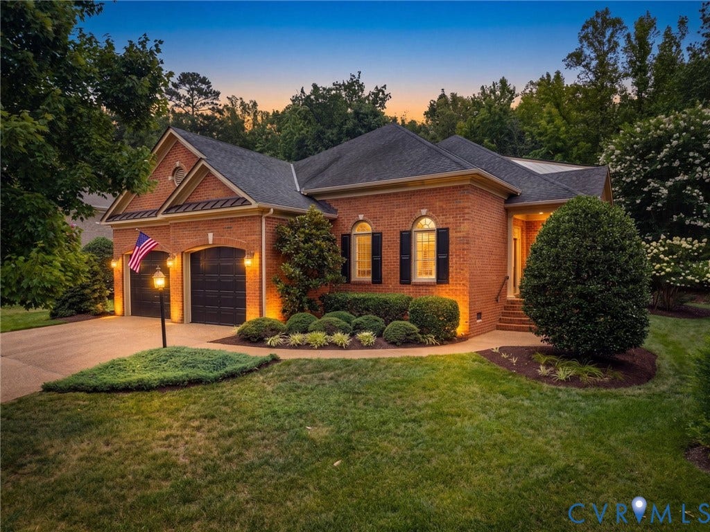 2214 Founders View Lane, Fb Golf Villas, Powhatan, VA 23113 Brick exterior featuring arched windows with dark shutters, a two-car garage, and a covered entryway