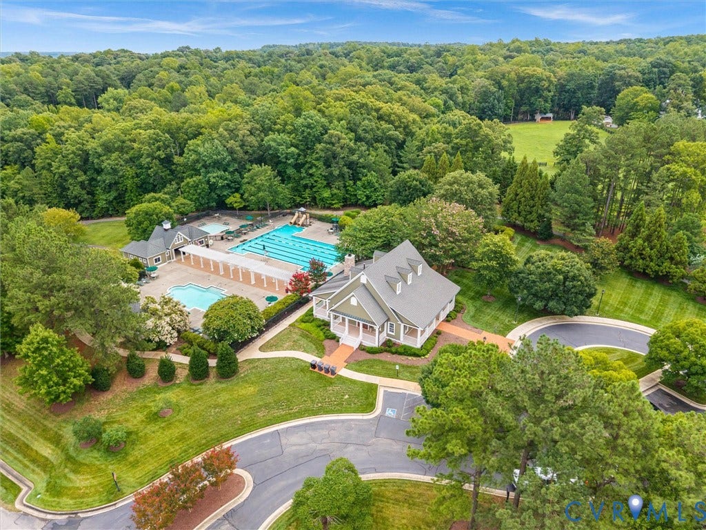 2214 Founders View Lane, Fb Golf Villas, Powhatan, VA 23113 Community clubhouse and pool complex featuring multiple swimming pools, a water slide, and ample lounge areas