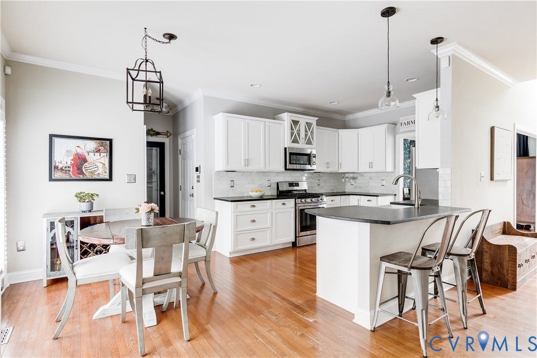 4907 Winding Branch Road, Moseley, VA 23120 Kitchen featuring white cabinetry, stainless steel appliances, leathered granite countertops, and a white subway tile backsplash