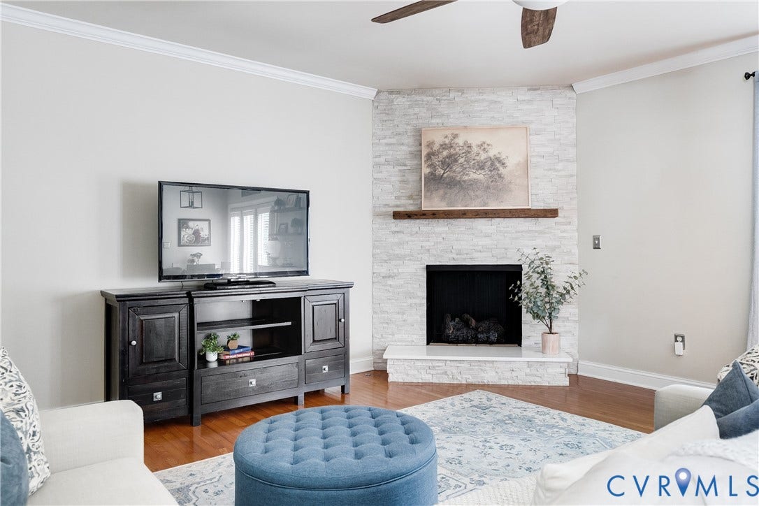 4907 Winding Branch Road, Moseley, VA 23120 Living room featuring a stacked stone fireplace with a wood mantle