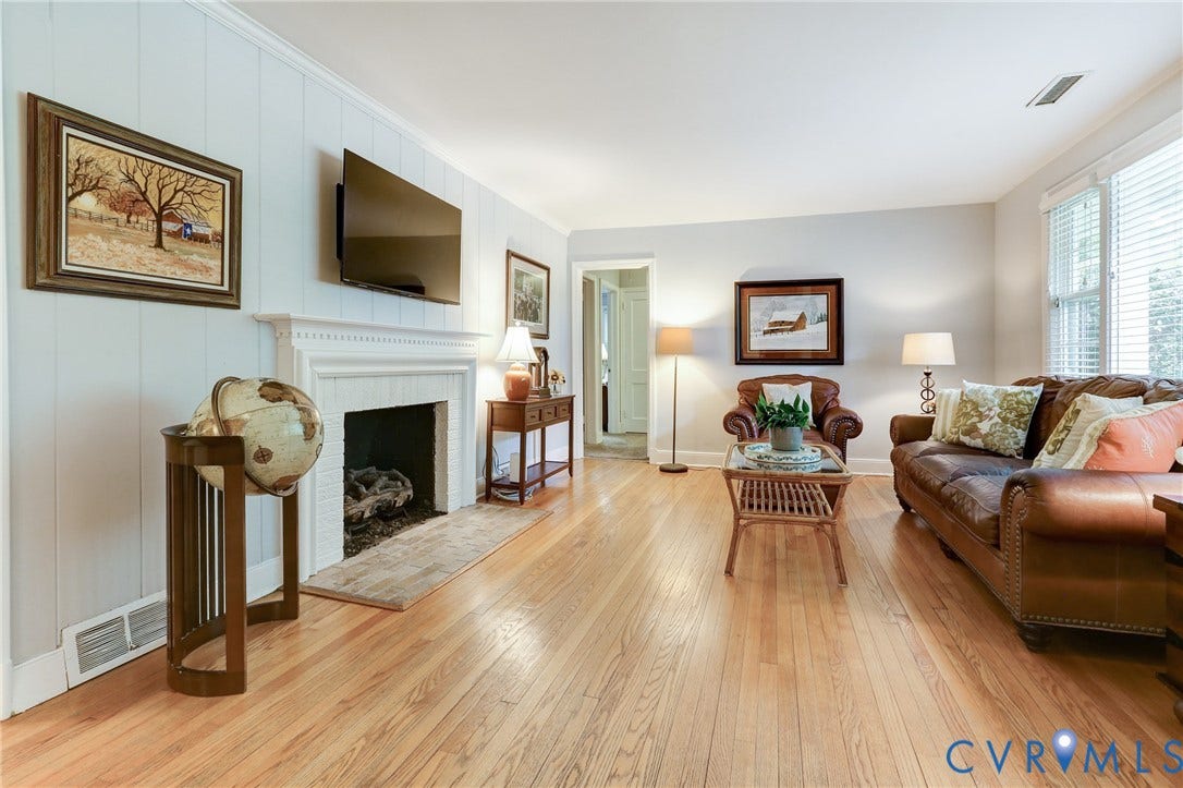 1401 Chowan Road, Henrico, VA 23229 Living area featuring wood-finish flooring, a white mantelpiece, recessed lighting, and white horizontal blinds