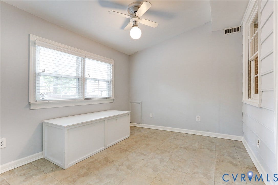 1401 Chowan Road, Henrico, VA 23229 Bright room featuring a vaulted ceiling and tile flooring