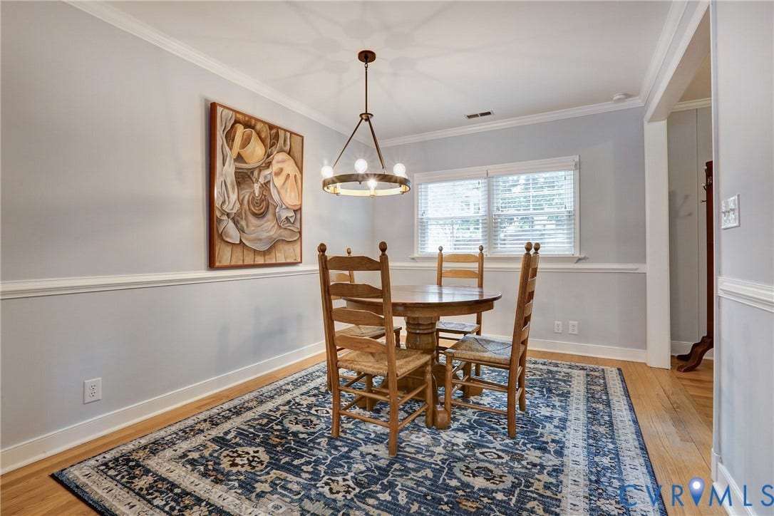 1401 Chowan Road, Henrico, VA 23229 Dining area featuring hardwood flooring, crown molding, chair rail detailing, and a bronze chandelier