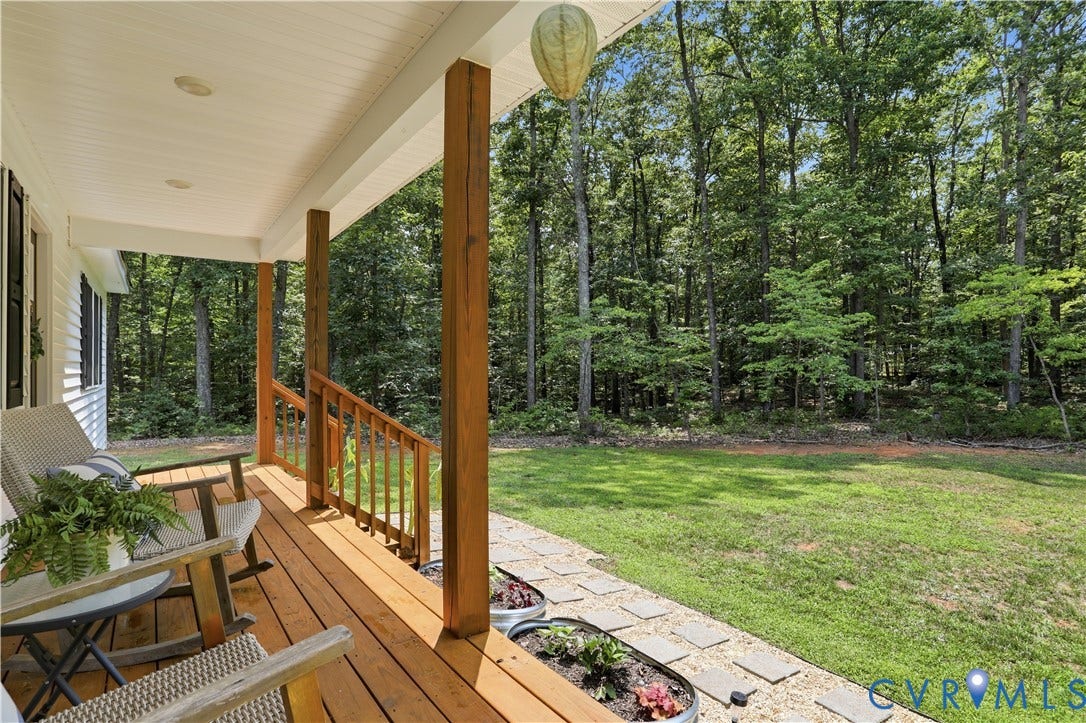 4939 Shannon Hill Road, Kents Store, VA 23084 Inviting covered porch with natural wood flooring and substantial wood support columns