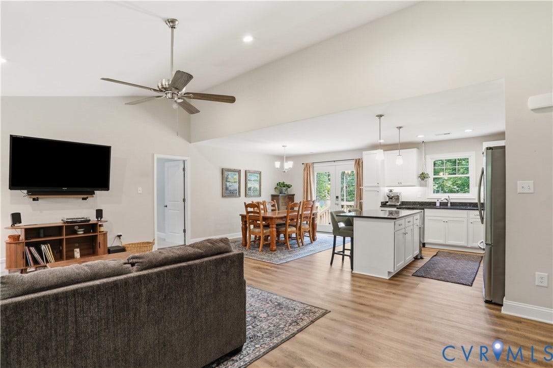 4939 Shannon Hill Road, Kents Store, VA 23084 Open-concept living area featuring vaulted ceilings, wood-finish flooring, and recessed lighting