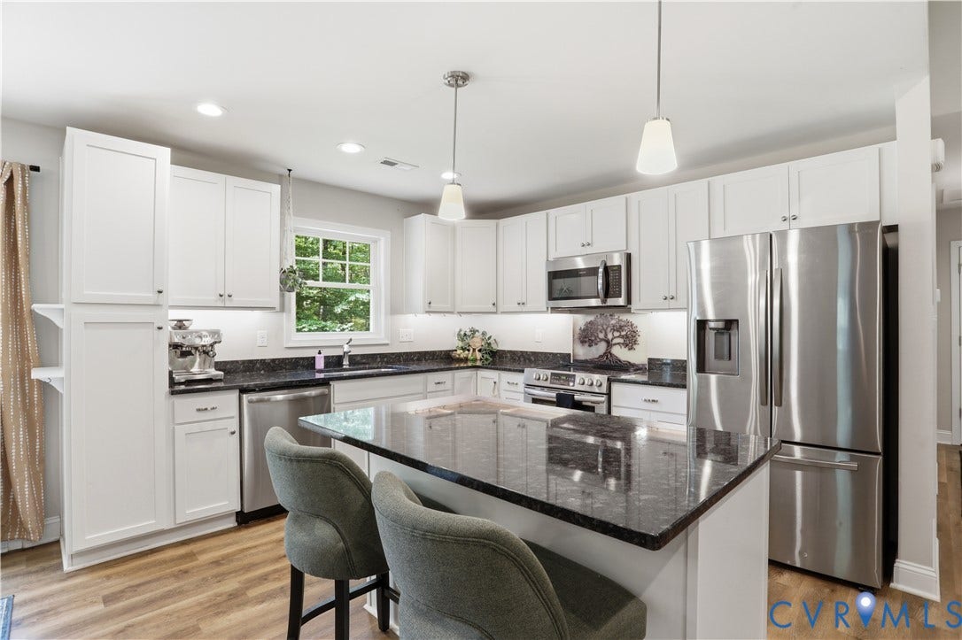 4939 Shannon Hill Road, Kents Store, VA 23084 Kitchen featuring white cabinetry, stainless steel appliances and granite counters