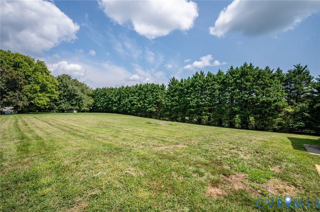 3508 Jefferson Landing Road, #R, Powhatan, VA 23139 Expansive grassy area featuring mature perimeter trees