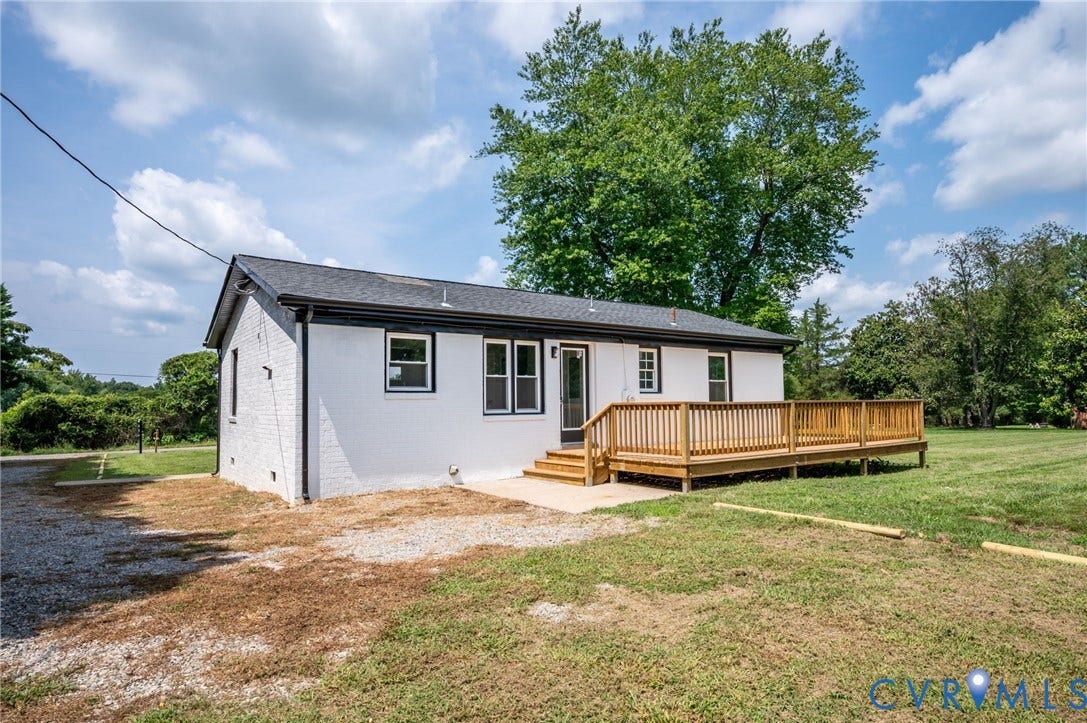 3508 Jefferson Landing Road, #R, Powhatan, VA 23139 White brick exterior with black trim, wood deck, and a dark shingle roof