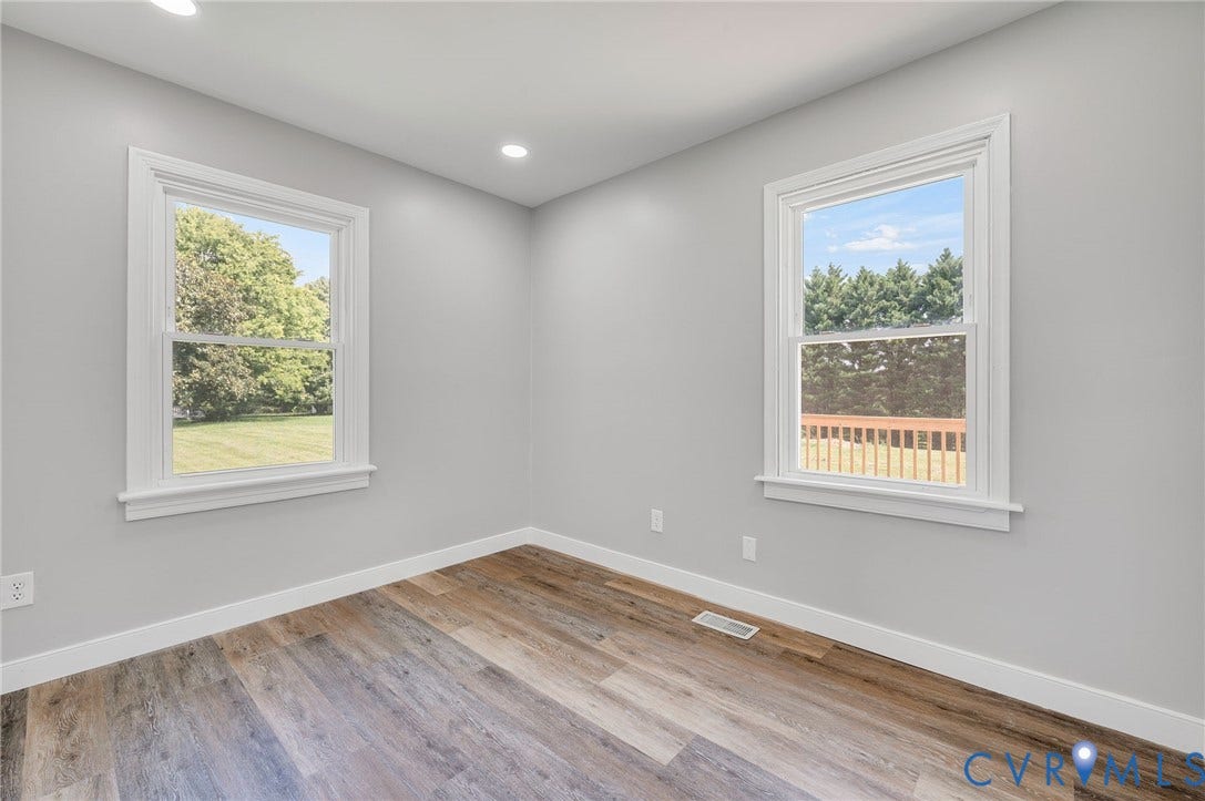 3508 Jefferson Landing Road, #R, Powhatan, VA 23139 Wood-finish flooring, recessed lighting, and dual windows with white trim