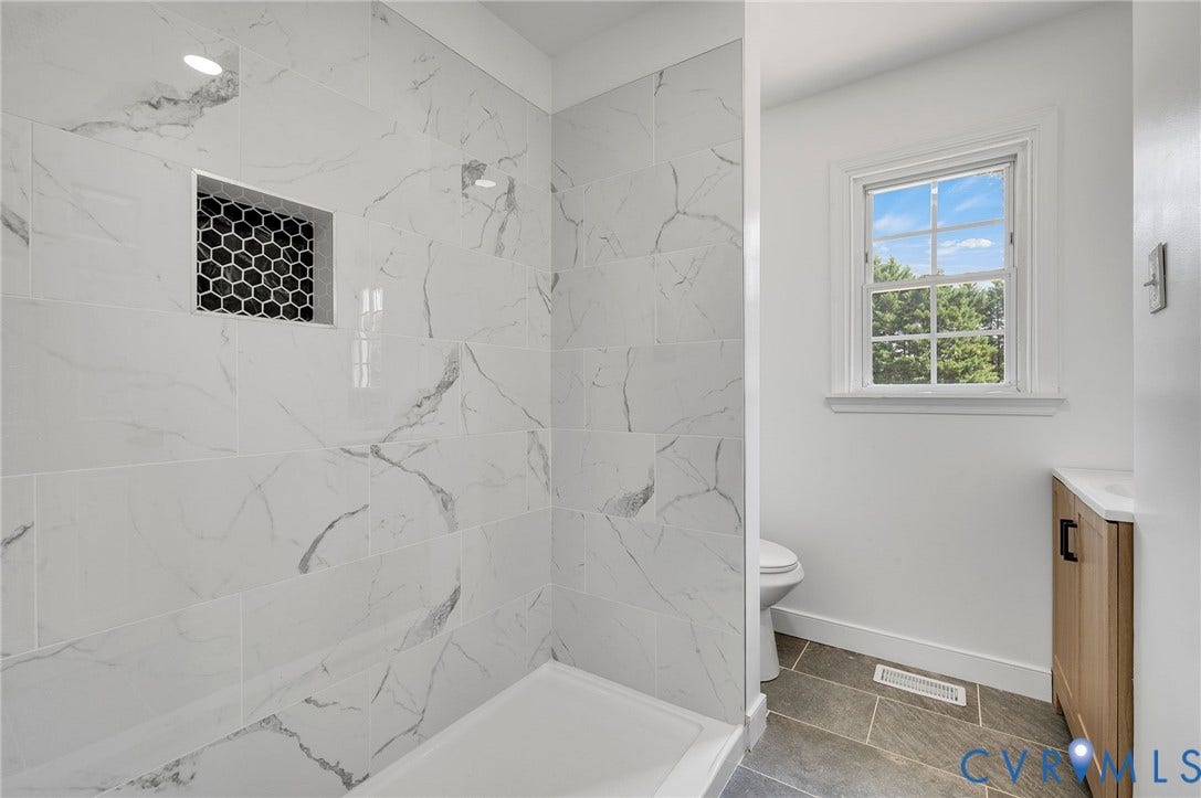 3508 Jefferson Landing Road, #R, Powhatan, VA 23139 Shower featuring large format tile with a built-in niche, hexagonal accent tile, and a recessed light