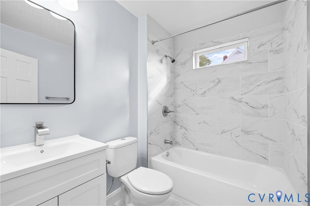 3516 Virginia Street, Woodlawn, Hopewell, VA 23860 White vanity with integrated sink and chrome faucet