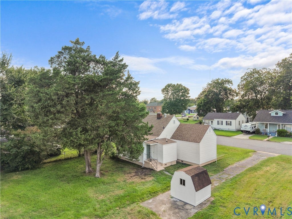 3516 Virginia Street, Woodlawn, Hopewell, VA 23860 White exterior, screened porch, detached storage shed, paved driveway, mature trees