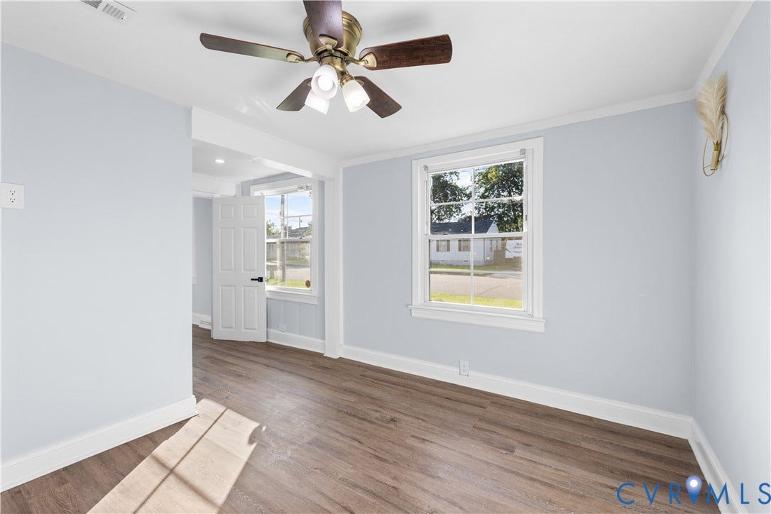 3516 Virginia Street, Woodlawn, Hopewell, VA 23860 Wood-finish flooring, light blue wall paint, and white trim