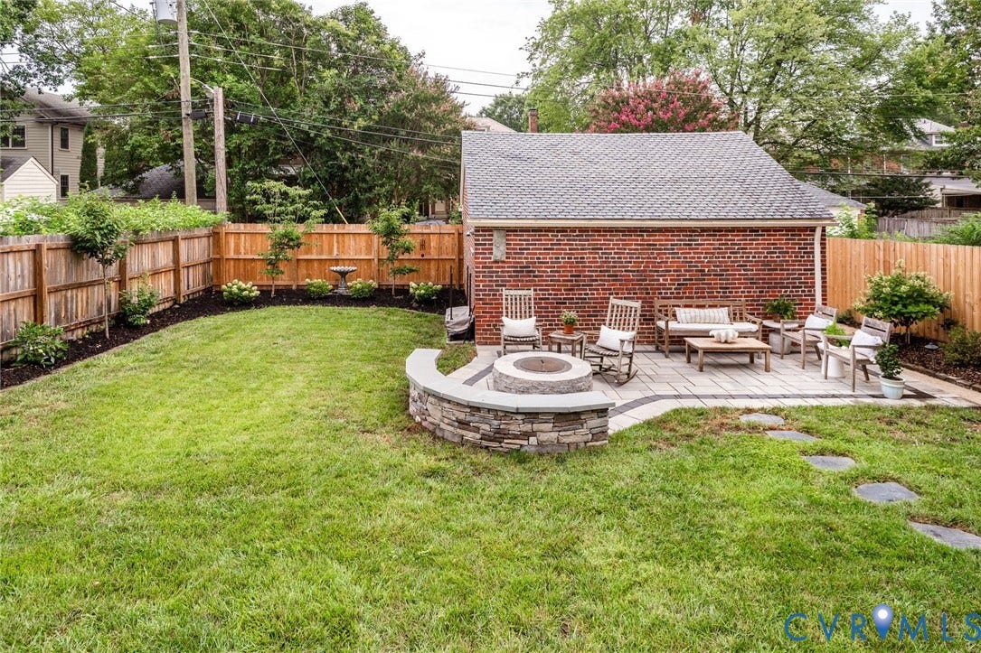 3912 Park Avenue, Malvern Gardens, Richmond, VA 23221 Expansive backyard featuring a stone paver patio, integrated fire pit with stone surround, and 2-car garage.
