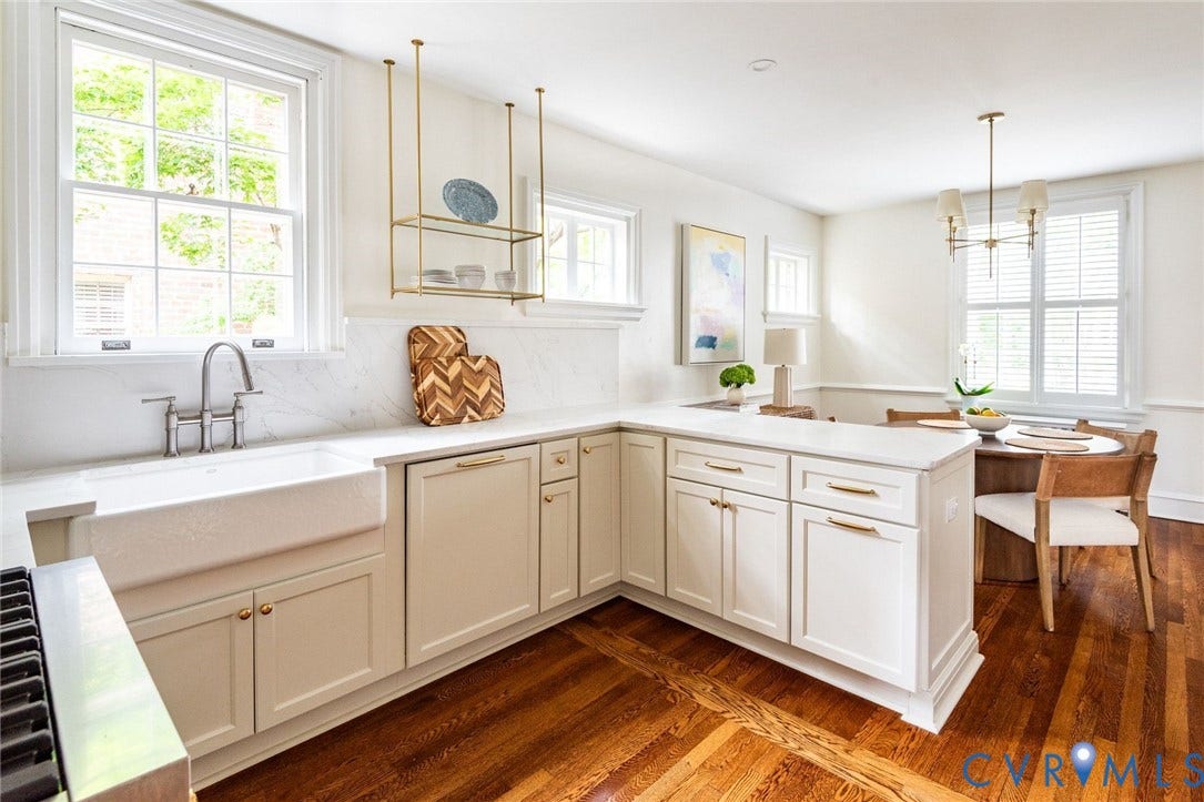 3912 Park Avenue, Malvern Gardens, Richmond, VA 23221 Kitchen featuring white perimeter cabinetry, a farmhouse sink, white countertops. Access to custom coffee bar at entry/back stoop
