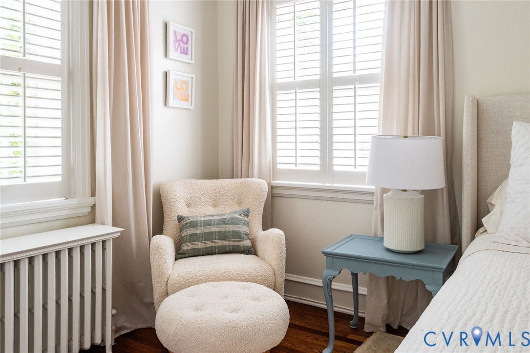 3912 Park Avenue, Malvern Gardens, Richmond, VA 23221 Hardwood flooring featuring white walls and a large window with plantation shutters, double closets