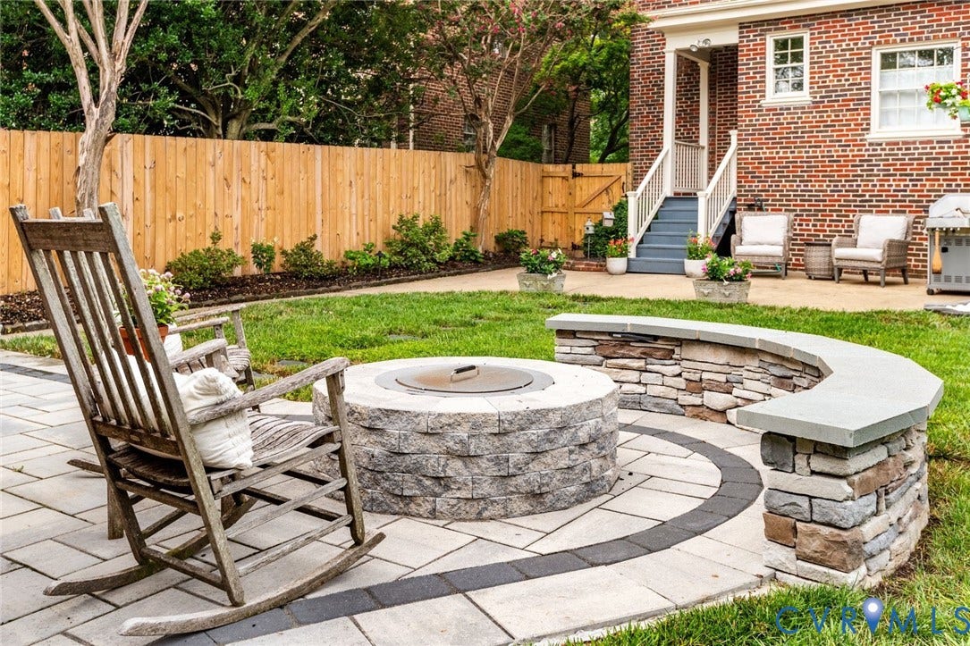 3912 Park Avenue, Malvern Gardens, Richmond, VA 23221 Expansive backyard w/ brand new paver patio and stone fire pit w/ surrounding stone seating wall, manicured lawn, professional landscaping, and a new solid wood privacy fence