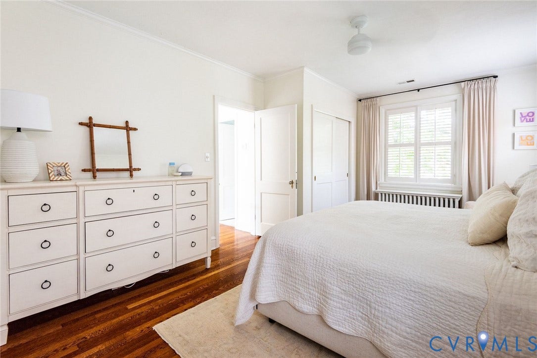 3912 Park Avenue, Malvern Gardens, Richmond, VA 23221 Hardwood flooring throughout featuring white walls and a large window with plantation shutters