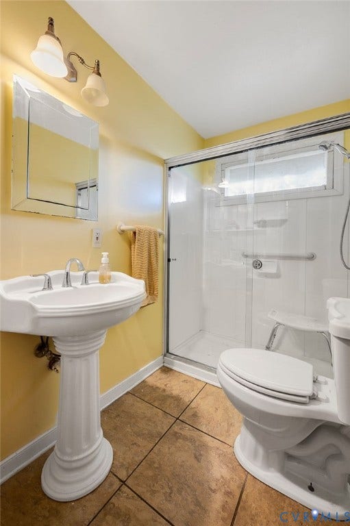 1910 Fon Du Lac Road, Henrico, VA 23229 Pedestal sink with chrome fixtures, framed mirror, and two-light vanity fixture