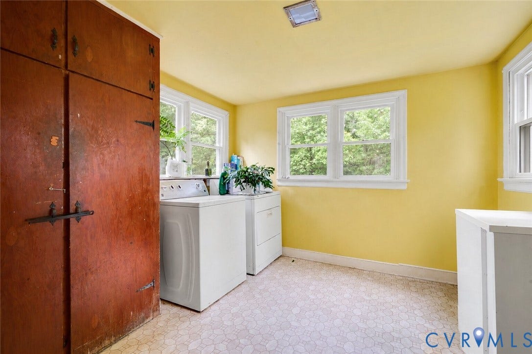 1910 Fon Du Lac Road, Henrico, VA 23229 Utility room featuring multiple windows, built-in wooden cabinetry, and patterned flooring