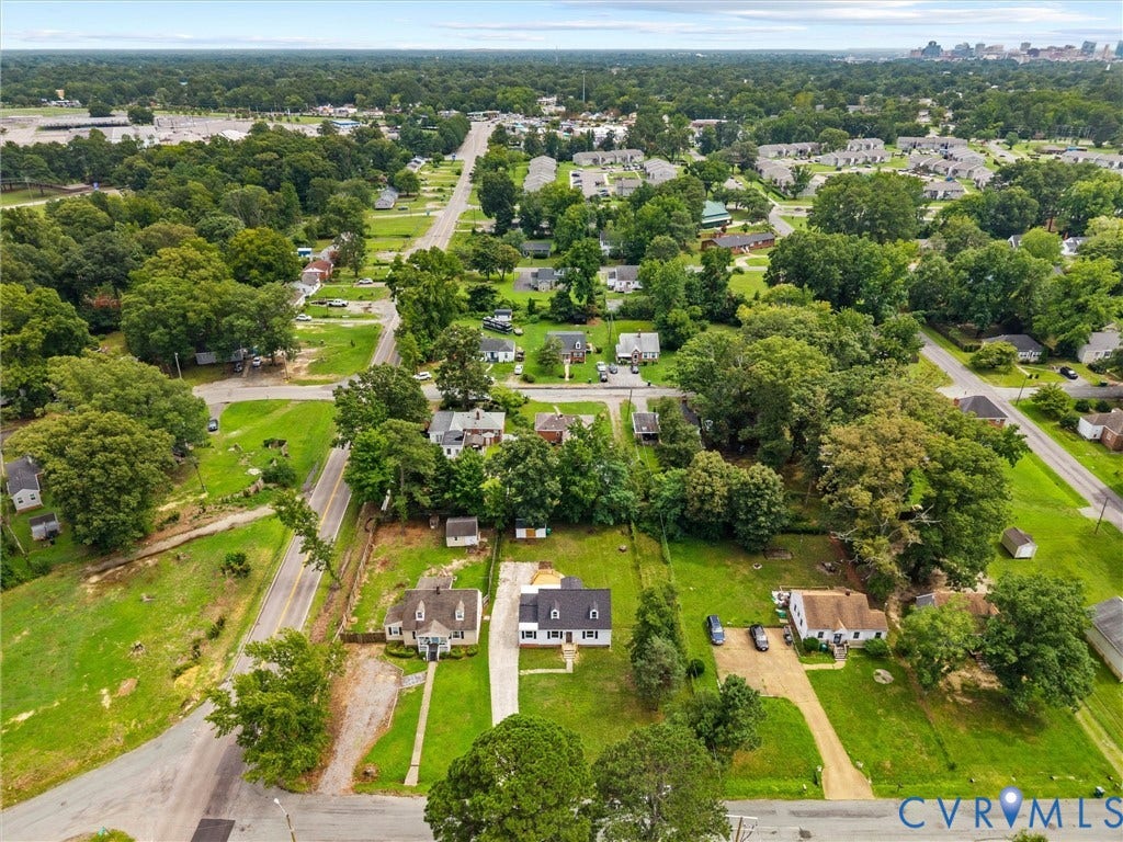 507 Grayson Avenue, Richmond, VA 23222 Expansive aerial highlighting a residential property with a dark-pitched roof and a long gravel driveway