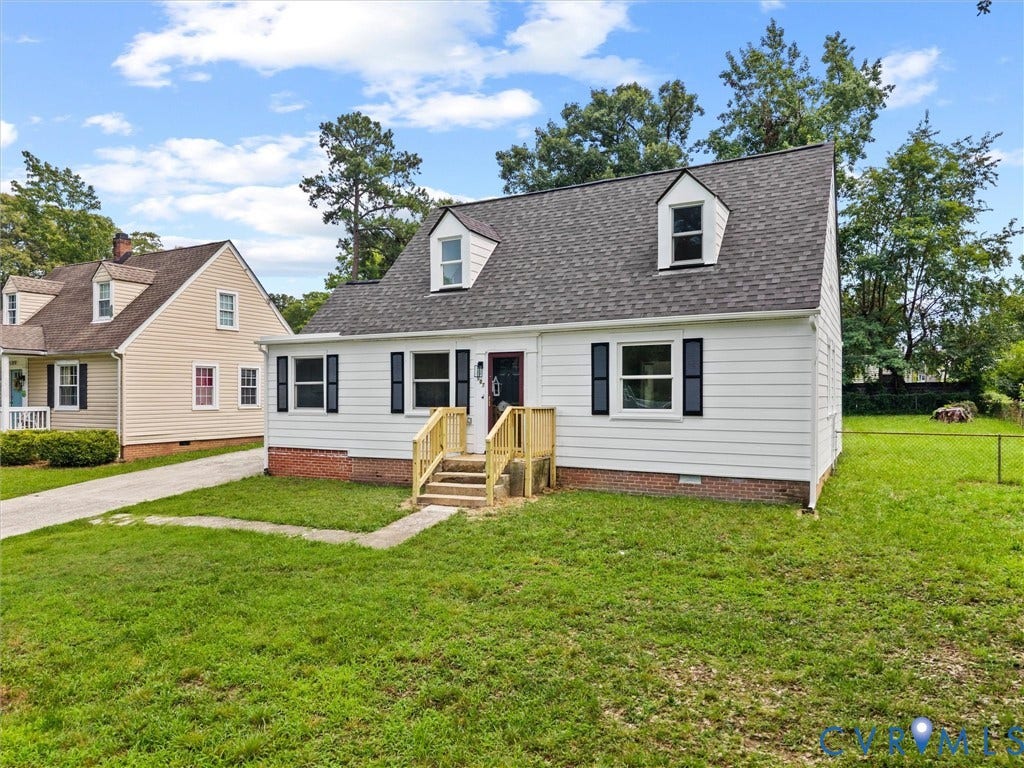 507 Grayson Avenue, Richmond, VA 23222 Front exterior featuring white siding, dark shutters, and a gray shingle roof