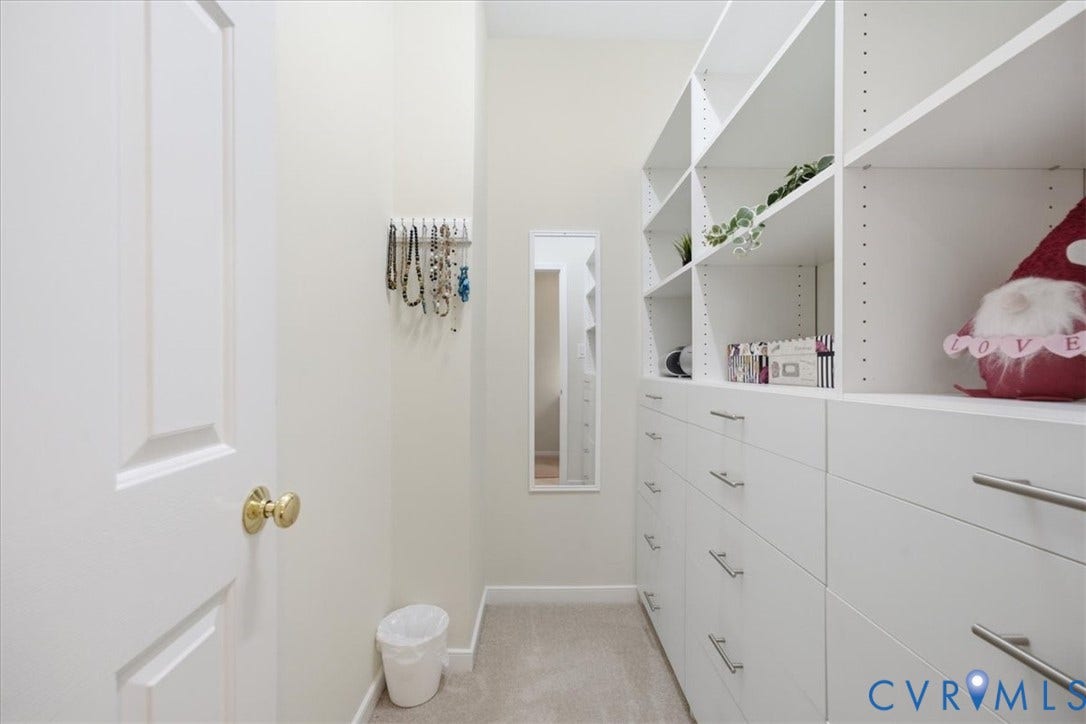 Built-in shelving and drawer storage with brushed nickel hardware